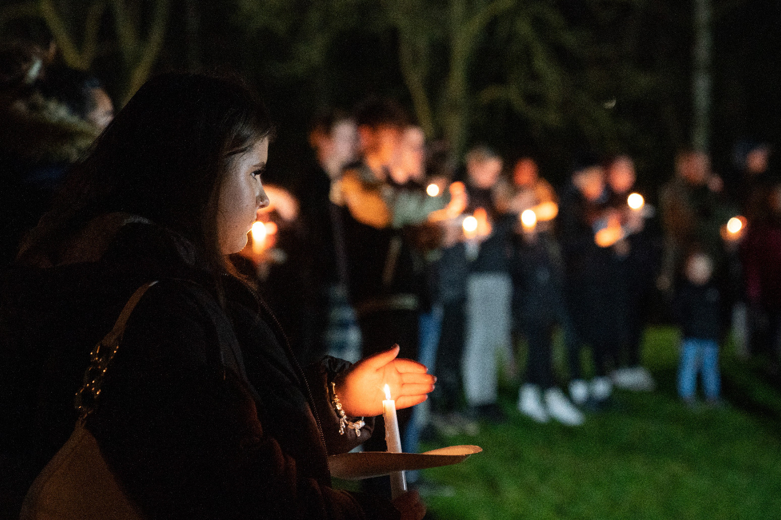 Candlelit vigil held for girl, four, who was mauled to death by pet dog 