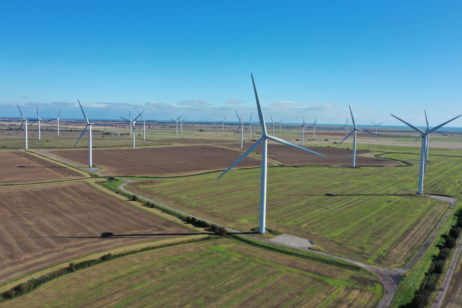 UK risks wasting wind farms achievement without new links to grid. 